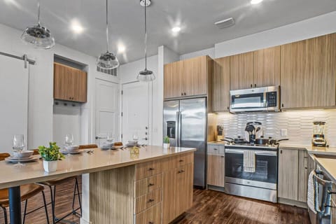 The kitchen invites you to experiment with new recipes, offering a stylish and practical space to cook and create.