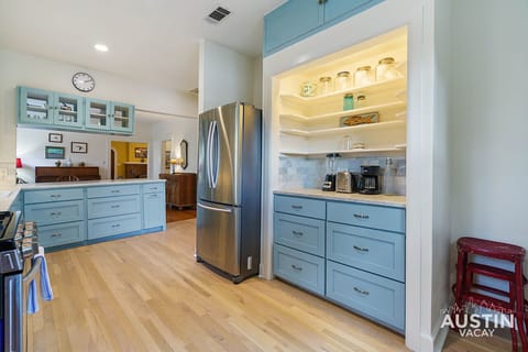 Colorful full kitchen with all the essentials including bar seating and dishwasher!
