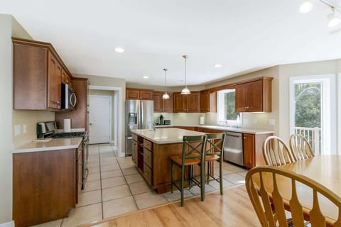 Chef’s kitchen with ample space, all essentials, and a central island.