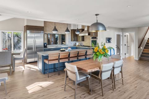 Kitchen & Dining Room: Well-equipped kitchen, 2 ovens, 6-burner stove, kitchen bar w/5 bar stools, 11-person dining table