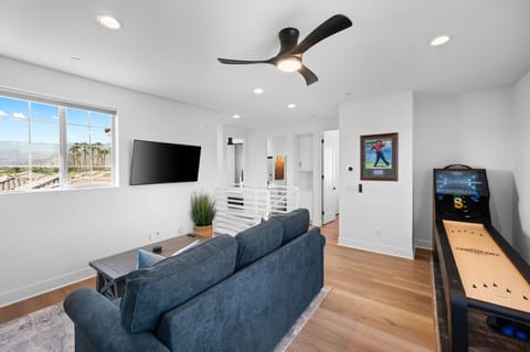 Game on! Enjoy a round of shuffleboard in this bright and spacious loft area