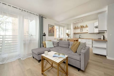 Living room with a comfortable sofa, coffee table, and TV offers the perfect place to relax.