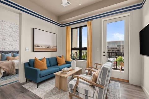 Open-concept living room with smart TV and cozy seating.