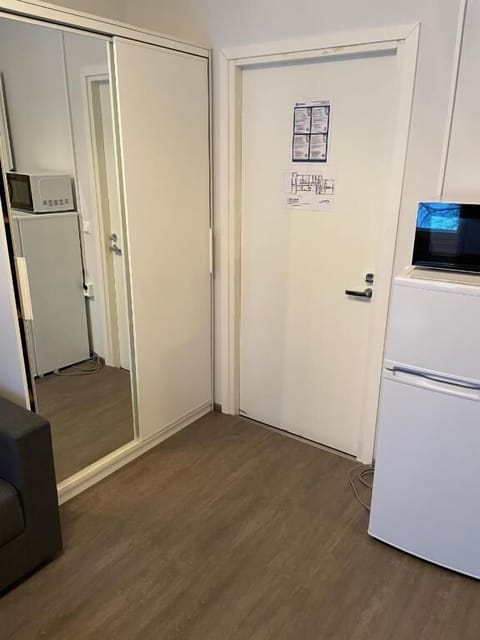 Room entrance, wardrobe and fridge