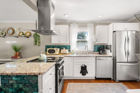 Generous, spacious kitchen perfect for cooking and gathering.