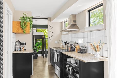 Fully stocked kitchen with all the utensils and appliances you might need and lots of natural light. We provide a Keurig machine with K-cups for your morning routine.