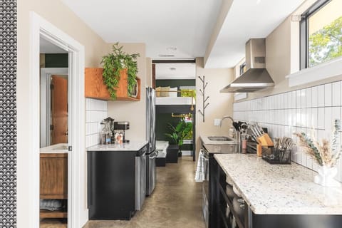 Fully stocked kitchen with all the utensils and appliances you might need and lots of natural light.