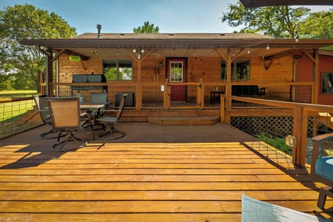 Back deck featuring outdoor dining, outdoor lounge set, bbq, pool, swing.