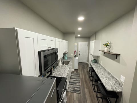 Kitchen with breakfast bar and stools