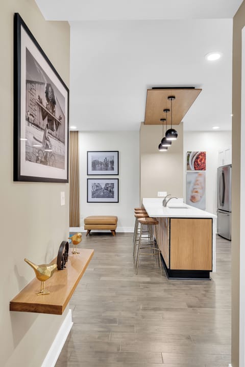 Artful decor and modern design elements create a welcoming entrance to your stylish New Orleans getaway.