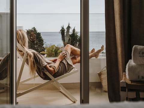 Double Room, Partial Sea View | Premium bedding, memory foam beds, minibar, in-room safe