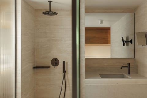 Shower, designer toiletries, hair dryer, bathrobes