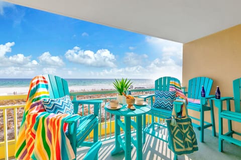 Welcome to Pelican Isle 215 - The Emerald Spritz! Sip your morning coffee on your private balcony while watching waves dance across pristine white sand.