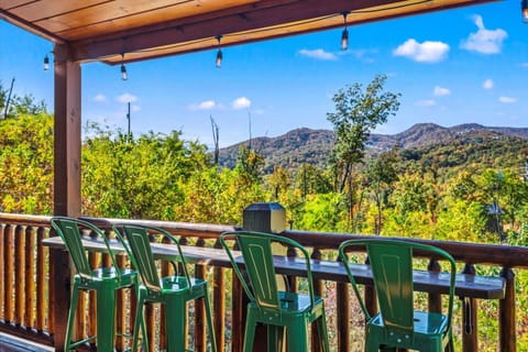 Enjoy breathtaking views of Ober Gatlinburg from this scenic deck! Relax with a drink at the bar-style seating while soaking in the mountain beauty. A perfect spot to unwind and take in the fresh Smoky Mountain air, just minutes from downtown!