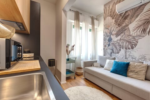Apartment | Living area | 24-inch flat-screen TV with digital channels
