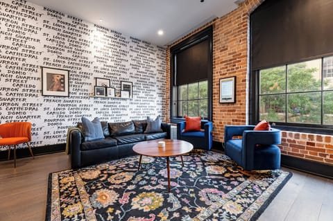 Relax in the living area with a smart TV, stylish seating, and a sleeper sofa for extra guests. Perfect for families or group stays in New Orleans, this inviting space is ideal for movie nights or recharging after a day in the city.