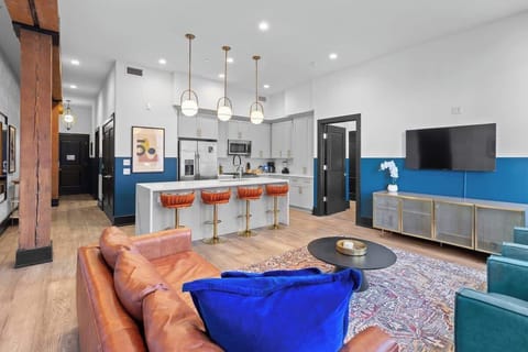 Relax in the living area with a smart TV, stylish seating and a sleeper sofa for extra guests. Perfect for families or group stays in New Orleans, this inviting space is ideal for movie nights or recharging after a day in the city.