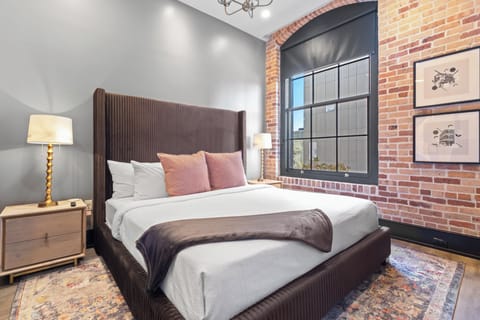 Retreat to the Primary bedroom with a plush king bed, walk-in closet, blackout shades, and a smart TV. Designed for comfort and privacy, this suite is perfect for recharging after a day exploring New Orleans.