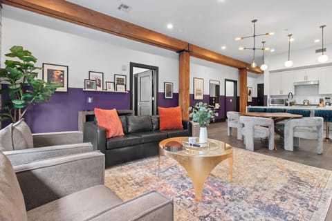 Relax in the living area with a smart TV, stylish seating and a sleeper sofa for extra guests. Perfect for families or group stays in New Orleans, this inviting space is ideal for movie nights or recharging after a day in the city.