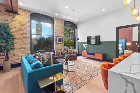 Relax in the living area with a smart TV, stylish seating and a sleeper sofa for extra guests. Perfect for families or group stays in New Orleans, this inviting space is ideal for movie nights or recharging after a day in the city.
