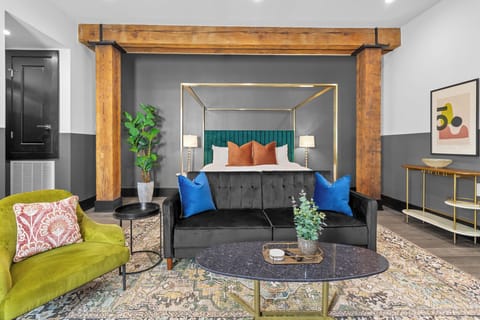 Relax in the living area with a smart TV, stylish seating, and a sleeper sofa for extra guests. Perfect for families or group stays in New Orleans, this inviting space is ideal for movie nights or recharging after a day in the city.