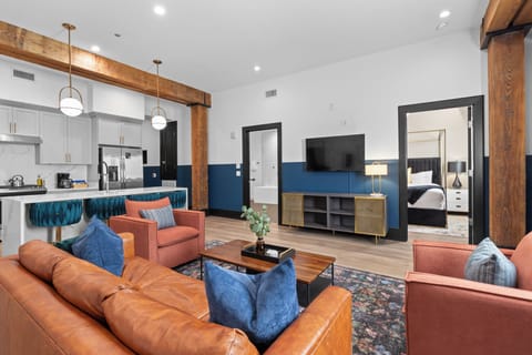 Relax in the living area with a smart TV, stylish seating, and a sleeper sofa for extra guests. Perfect for families or group stays in New Orleans, this inviting space is ideal for movie nights or recharging after a day in the city.