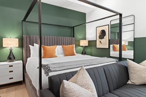 Relax in the studio living area with a smart TV, stylish seating, king-sized bed and a futon for extra guest. This inviting space is ideal for movie nights or recharging after a day in the city.