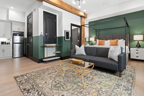 Relax in the studio living area with a smart TV, stylish seating, king-sized bed and a futon for extra guest. This inviting space is ideal for movie nights or recharging after a day in the city.