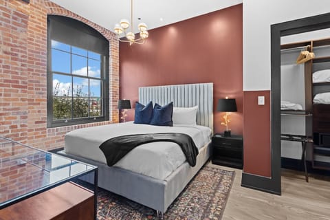 Retreat to the Primary bedroom with a plush king bed, walk-in closet, blackout shades, and a smart TV. Designed for comfort and privacy, this suite is perfect for recharging after a day exploring New Orleans.
