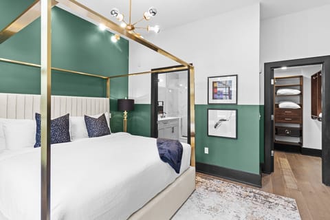 Retreat to the Primary bedroom with a plush king bed, walk-in closet, blackout shades, and a smart TV. Designed for comfort and privacy, this suite is perfect for recharging after a day exploring New Orleans.