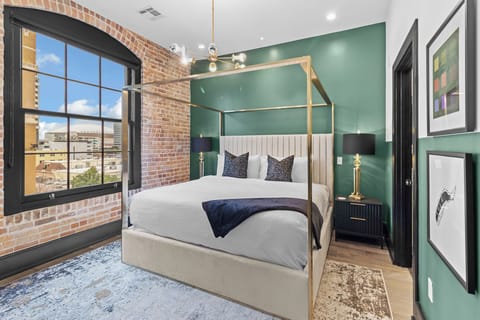 Retreat to the Primary bedroom with a plush king bed, walk-in closet, blackout shades, and a smart TV. Designed for comfort and privacy, this suite is perfect for recharging after a day exploring New Orleans.