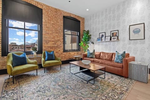 Relax in the living area with a smart TV, stylish seating, and a sleeper sofa for extra guests. Perfect for families or group stays in New Orleans, this inviting space is ideal for movie nights or recharging after a day in the city.