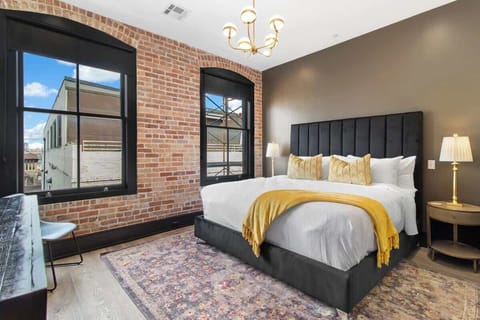 Retreat to the Primary bedroom with a plush king bed, walk-in closet, blackout shades, and a smart TV. Designed for comfort and privacy, this suite is perfect for recharging after a day exploring New Orleans.