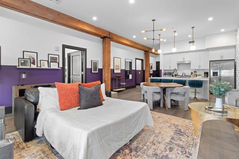 Relax in the living area with a smart TV, stylish seating, and a sleeper sofa for extra guests. Perfect for families or group stays in New Orleans, this inviting space is ideal for movie nights or recharging after a day in the city.