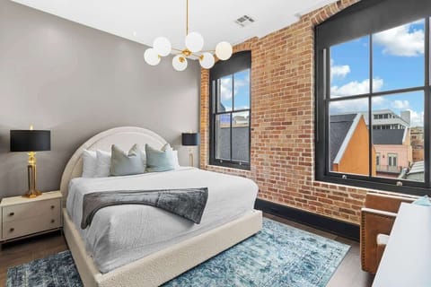 Retreat to the primary bedroom with a plush king bed, walk-in closet, blackout shades, and a smart TV. Designed for comfort and privacy, this suite is perfect for recharging after a day exploring New Orleans.