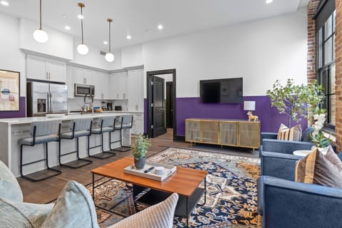 Relax in the living area with a smart TV, stylish seating, and a queen-size sleeper sofa for extra guests. Perfect for families or group stays in New Orleans, this inviting space is ideal for movie nights or recharging after a day in the city.