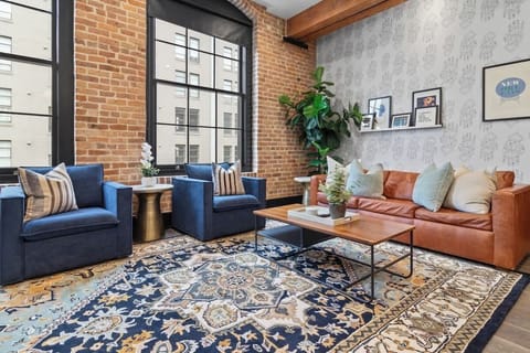 Relax in the living area with a smart TV, stylish seating, and a queen-size sleeper sofa for extra guests. Perfect for families or group stays in New Orleans, this inviting space is ideal for movie nights or recharging after a day in the city.