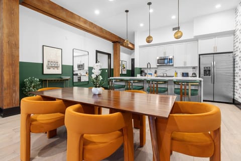 Enjoy meals together at your in-suite dining table with seating for your group. Whether it's takeout, delivery, or a home-cooked meal, this cozy dining area makes every stay at 888 Baronne feel like home in New Orleans.