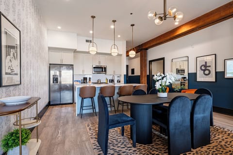 Enjoy meals together at your in-suite dining table with seating for your group. Whether it's takeout, delivery, or a home-cooked meal, this cozy dining area makes every stay at 888 Baronne feel like home in New Orleans.