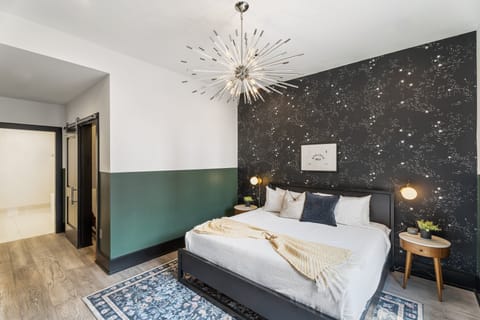 Retreat to the primary bedroom with a plush king bed, walk-in closet, blackout shades, and a smart TV. Designed for comfort and privacy, this suite is perfect for recharging after a day exploring New Orleans.