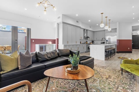 Relax in the living area with a smart TV, stylish seating, and a sleeper sofa for extra guests. Perfect for families or group stays in New Orleans, this inviting space is ideal for movie nights or recharging after a day in the city.