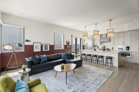 Relax in the living area with a smart TV, stylish seating, and a sleeper sofa for extra guests. Perfect for families or group stays in New Orleans, this inviting space is ideal for movie nights or recharging after a day in the city.