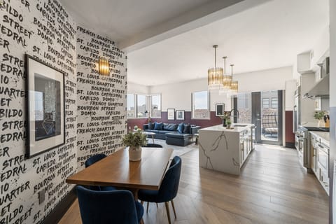 Enjoy meals together at your in-suite dining table with seating for your group. Whether it's takeout, delivery, or a home-cooked meal, this cozy dining area makes every stay at 888 Baronne feel like home in New Orleans.