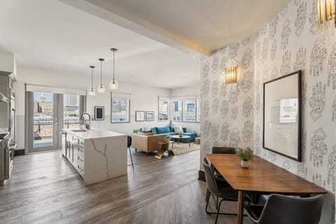 Enjoy meals together at your in-suite dining table with seating for your group. Whether it's takeout, delivery, or a home-cooked meal, this cozy dining area makes every stay at 888 Baronne feel like home in New Orleans.