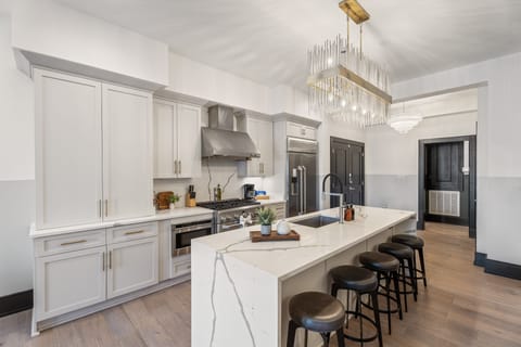 Cook or snack in style with a full kitchen featuring GE stainless appliances, cookware, and an island with bar seating. Ideal for short or extended stays, our kitchens make group travel in New Orleans easy and comfortable.