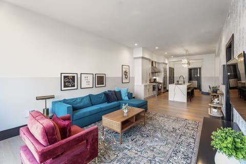 Relax in the living area with a smart TV, stylish seating, and a sleeper sofa for extra guests. Perfect for families or group stays in New Orleans, this inviting space is ideal for movie nights or recharging after a day in the city.