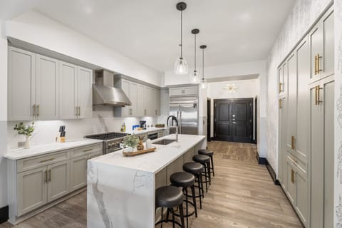 Cook or snack in style with a full kitchen featuring GE stainless appliances, cookware, and an island with bar seating. Ideal for short or extended stays, our kitchens make group travel in New Orleans easy and comfortable.