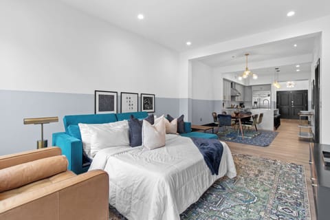 Relax in the living area with a smart TV, stylish seating, and a sleeper sofa for extra guests. Perfect for families or group stays in New Orleans, this inviting space is ideal for movie nights or recharging after a day in the city.