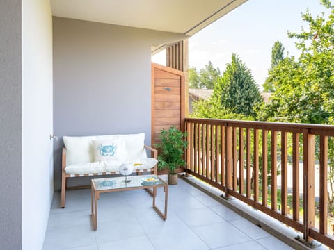 Plant, Building, Property, Couch, Table, Wood, Shade, Interior Design, Outdoor Furniture, Houseplant