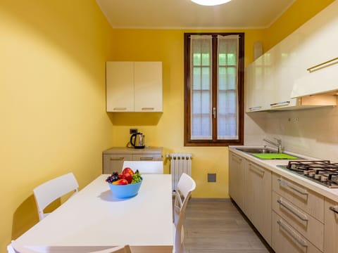 Table, Cabinetry, Property, Furniture, Countertop, Building, Window, Chair, Interior Design, Orange